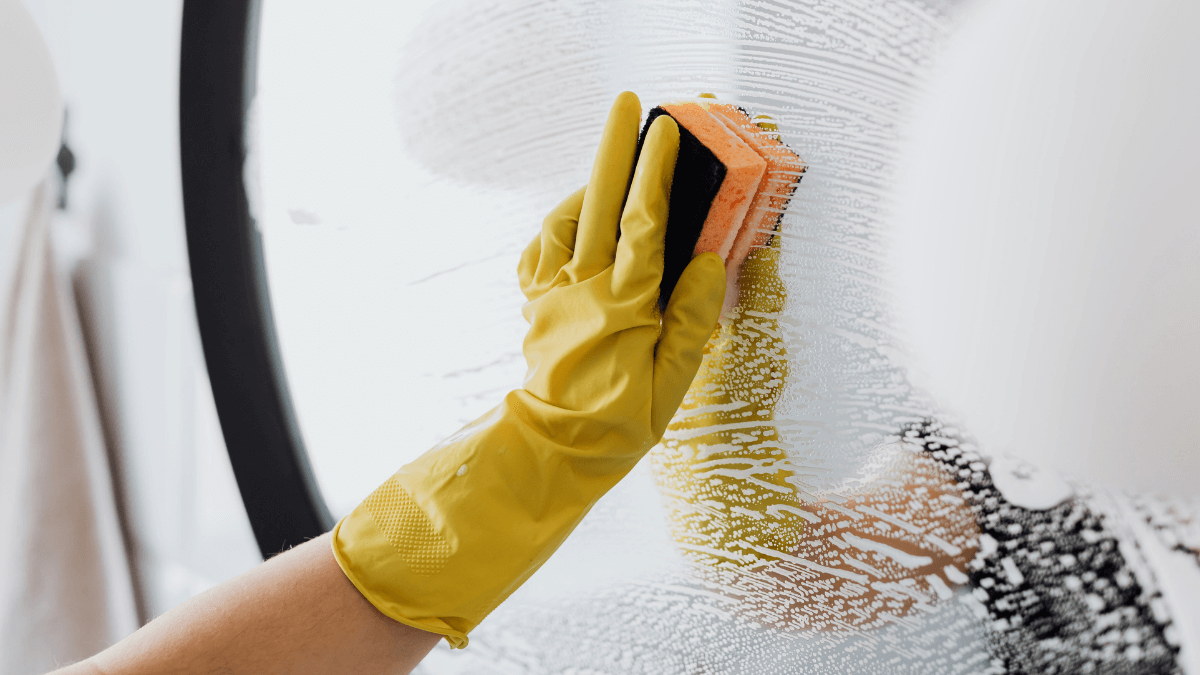 Clean surface of bathroom glass, floor, and toilet to remove stains.