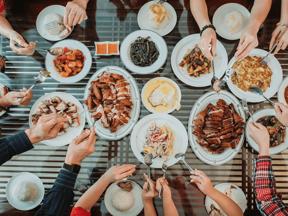 A beautifully set dinner table adorned with traditional Chinese New Year decorations, ready for a festive New Year's Eve dinner celebration, reflecting the joy and warmth of the holiday season.