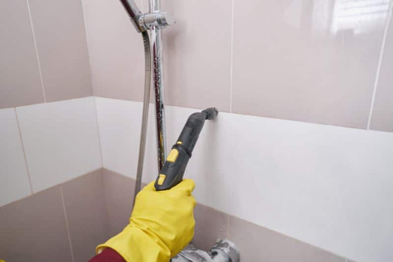 deep cleaning the wall tile of the bathroom