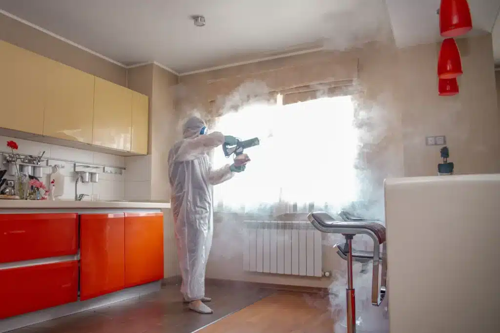a person holding air scrubbers to ensure thorough mold remediation